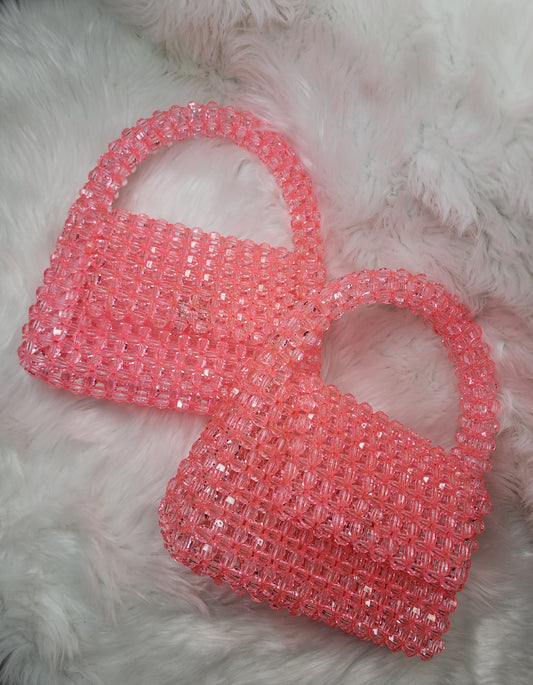 Top handle pink beaded purse